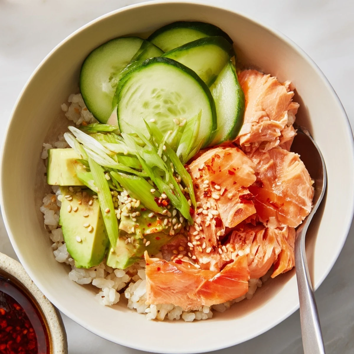 Quick and easy leftover salmon & rice bowl, inviting colors and flavors in every bite.