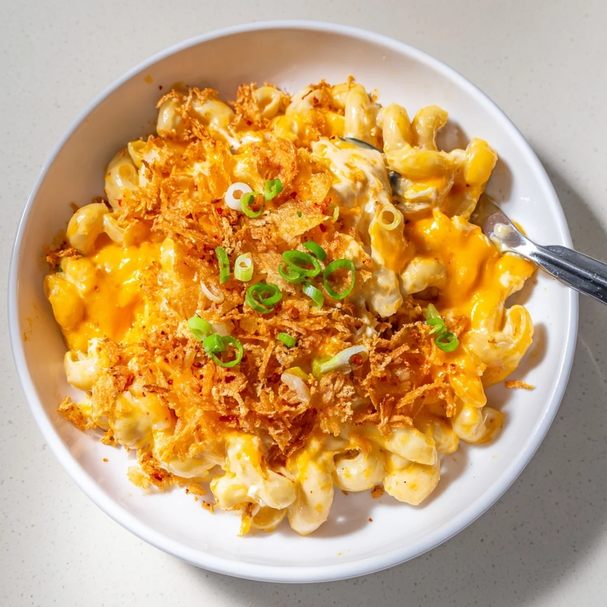 Bold and creamy Spicy Kimchi Mac & Cheese topped with crunchy sesame breadcrumbs.  