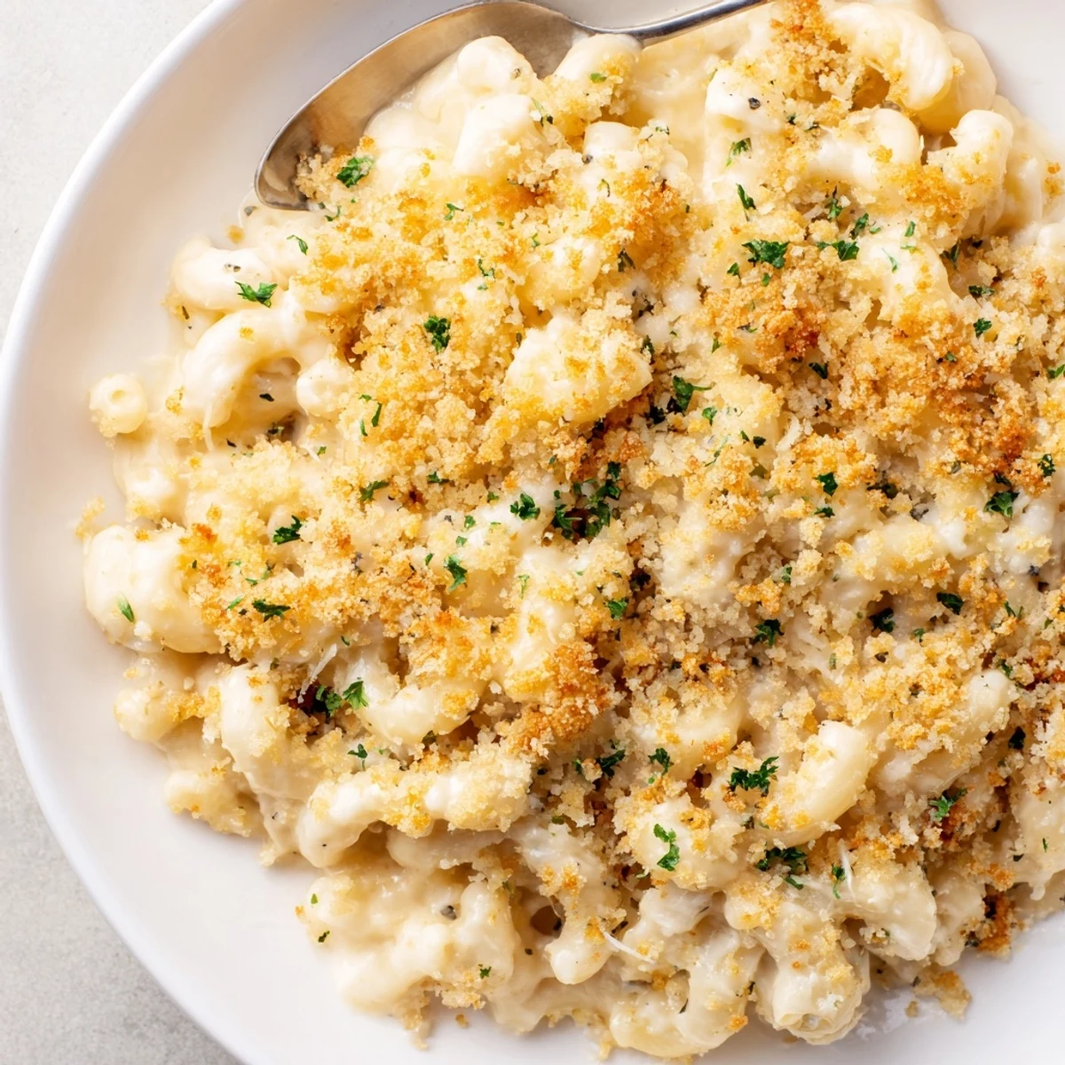 Creamy truffle macaroni and cheese bubbling in a golden crust, ready to serve.  
