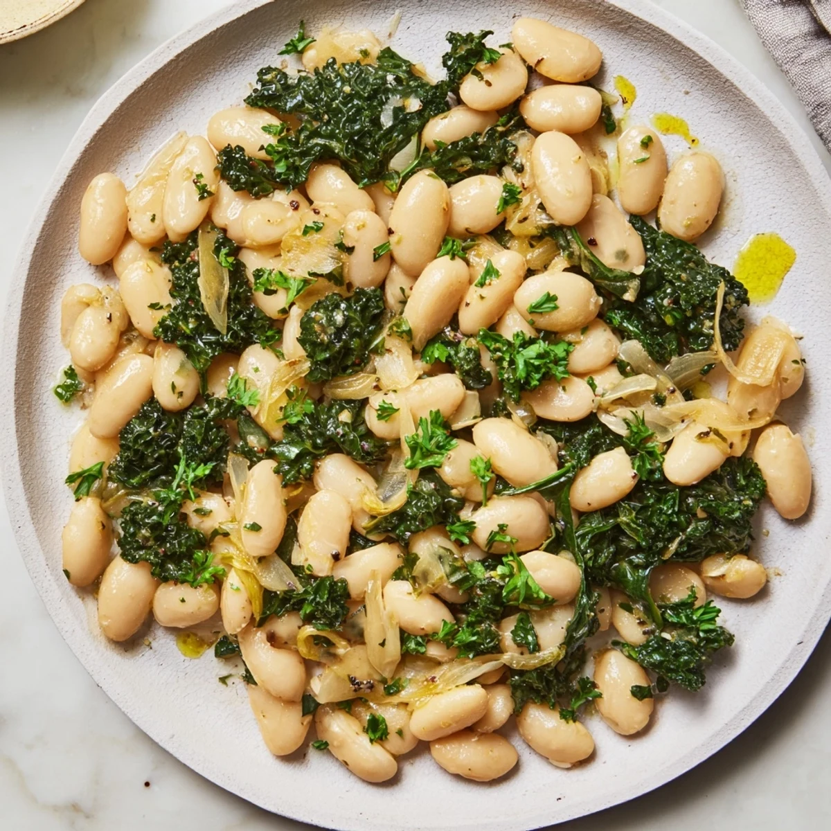 A steaming bowl of Garlicky Beans with Winter Greens, vibrant and ready to warm you.