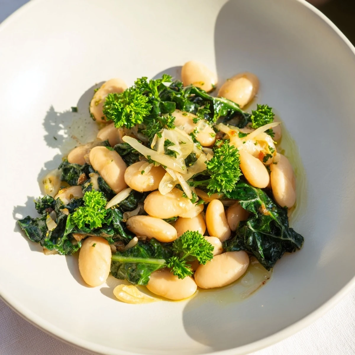 Fragrant Garlicky Beans with Winter Greens, a close-up of the rustic, comforting Mediterranean dish.