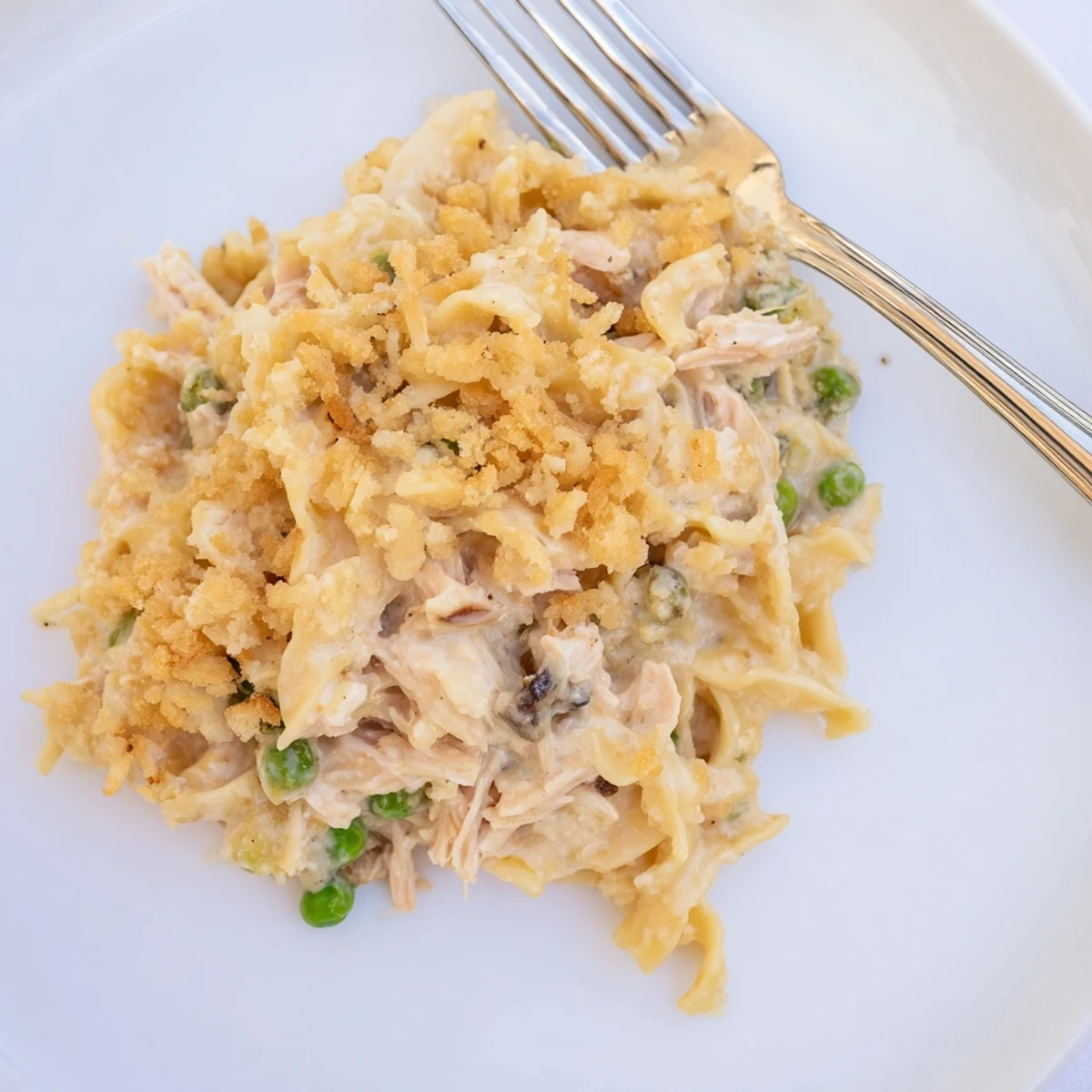 Perfectly baked Creamy Tuna Noodle Casserole, showcasing creamy tuna and noodle filling with a cracker crust.