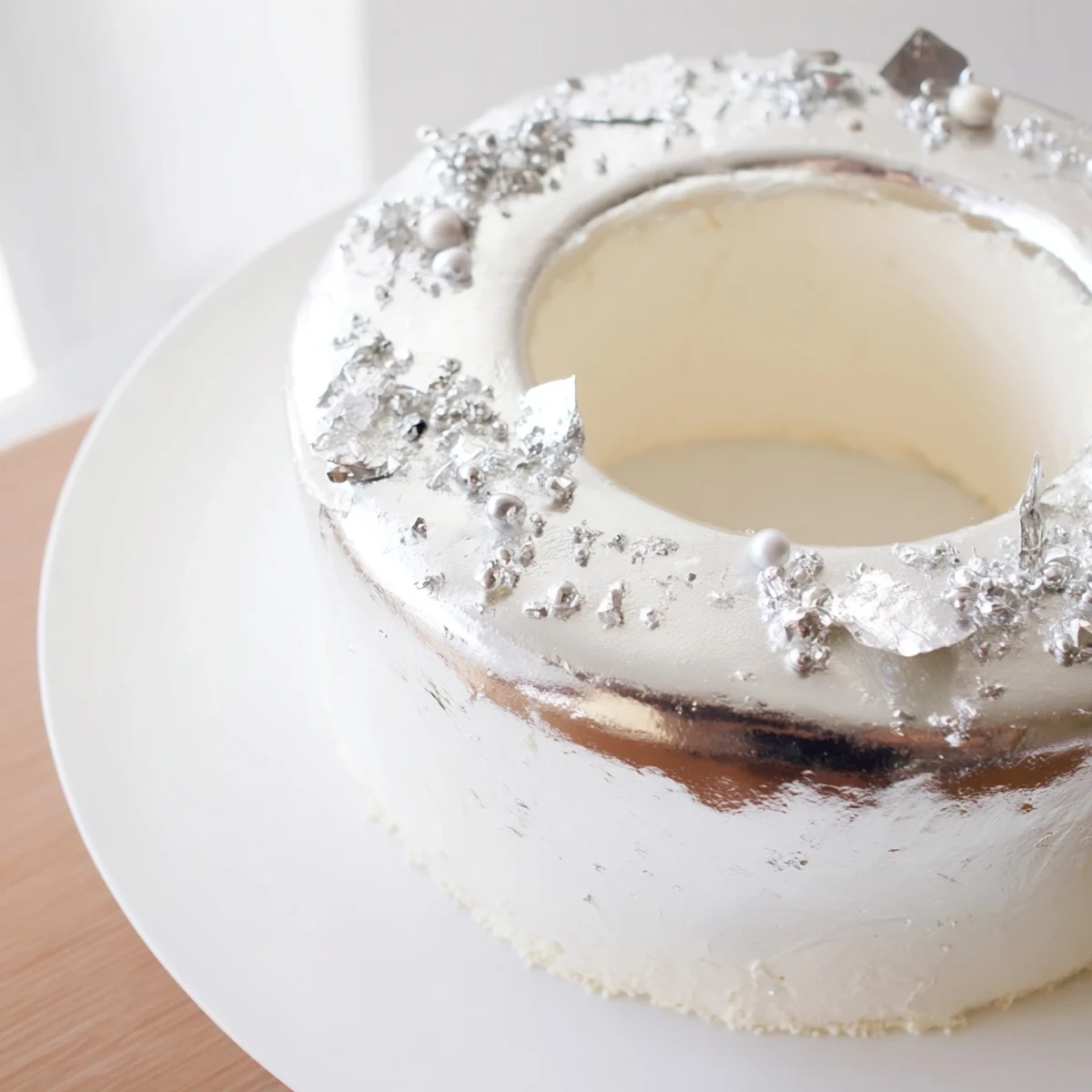 This Diamond Ring Engagement Cake showcases layers of white chocolate, creating a dazzling dessert for special events.