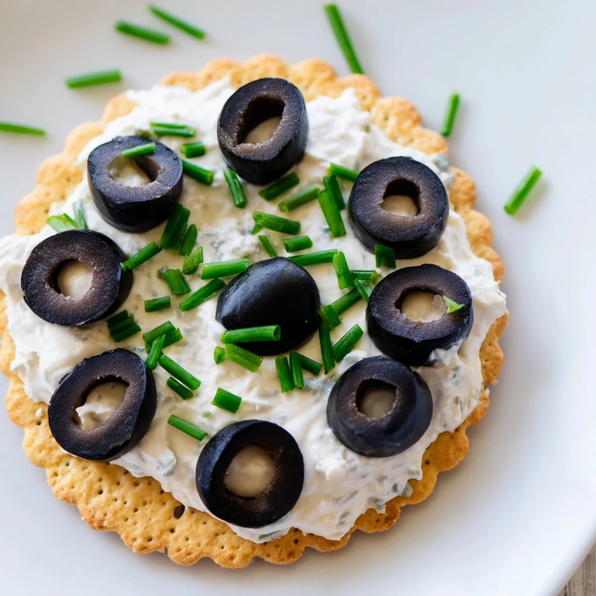Close-up of freshly made Gold Medal Olympic Ring Appetizers featuring cream cheese and colorful vegetables.