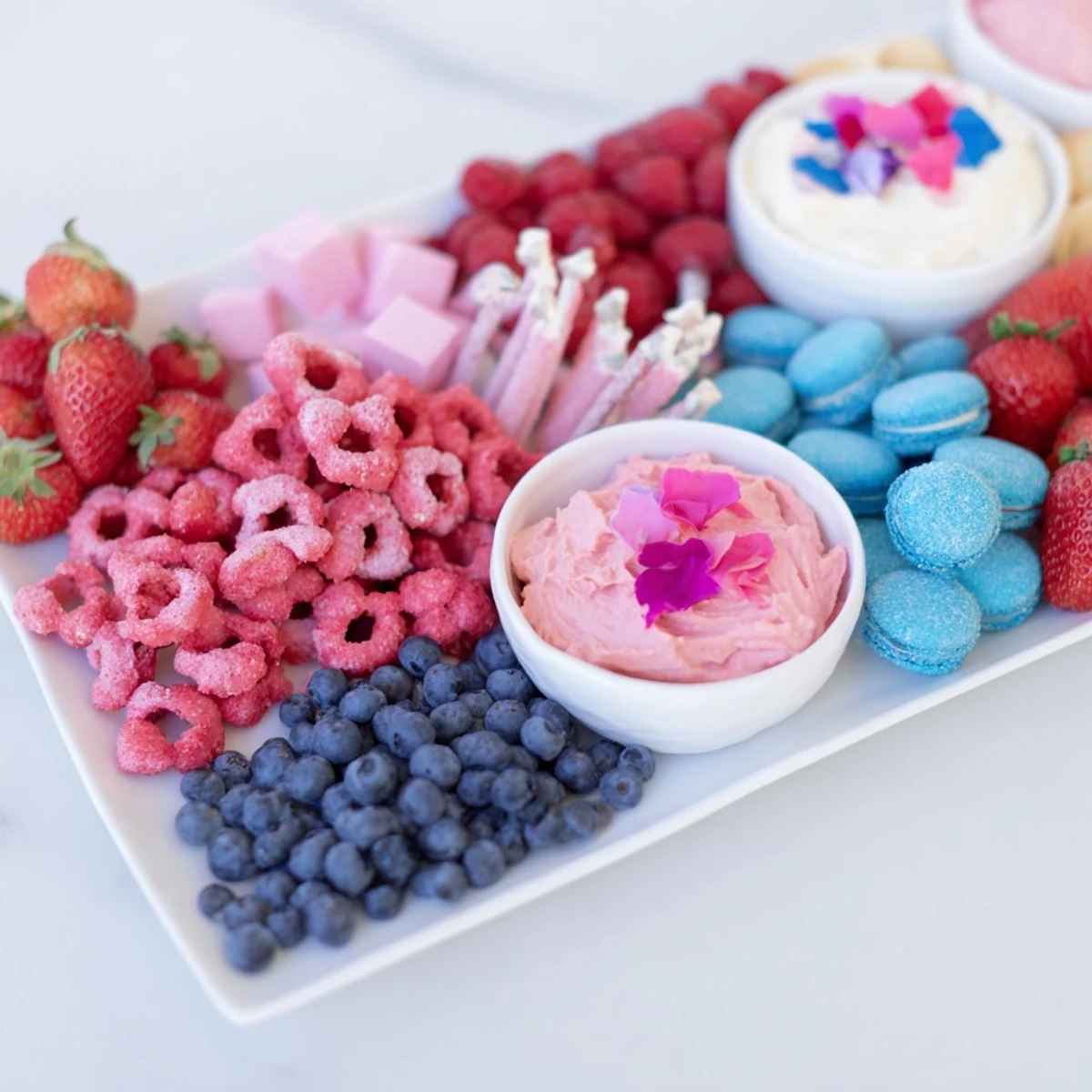 Delicious baby reveal snack board featuring an array of sweet and savory snacks, ready to enjoy.