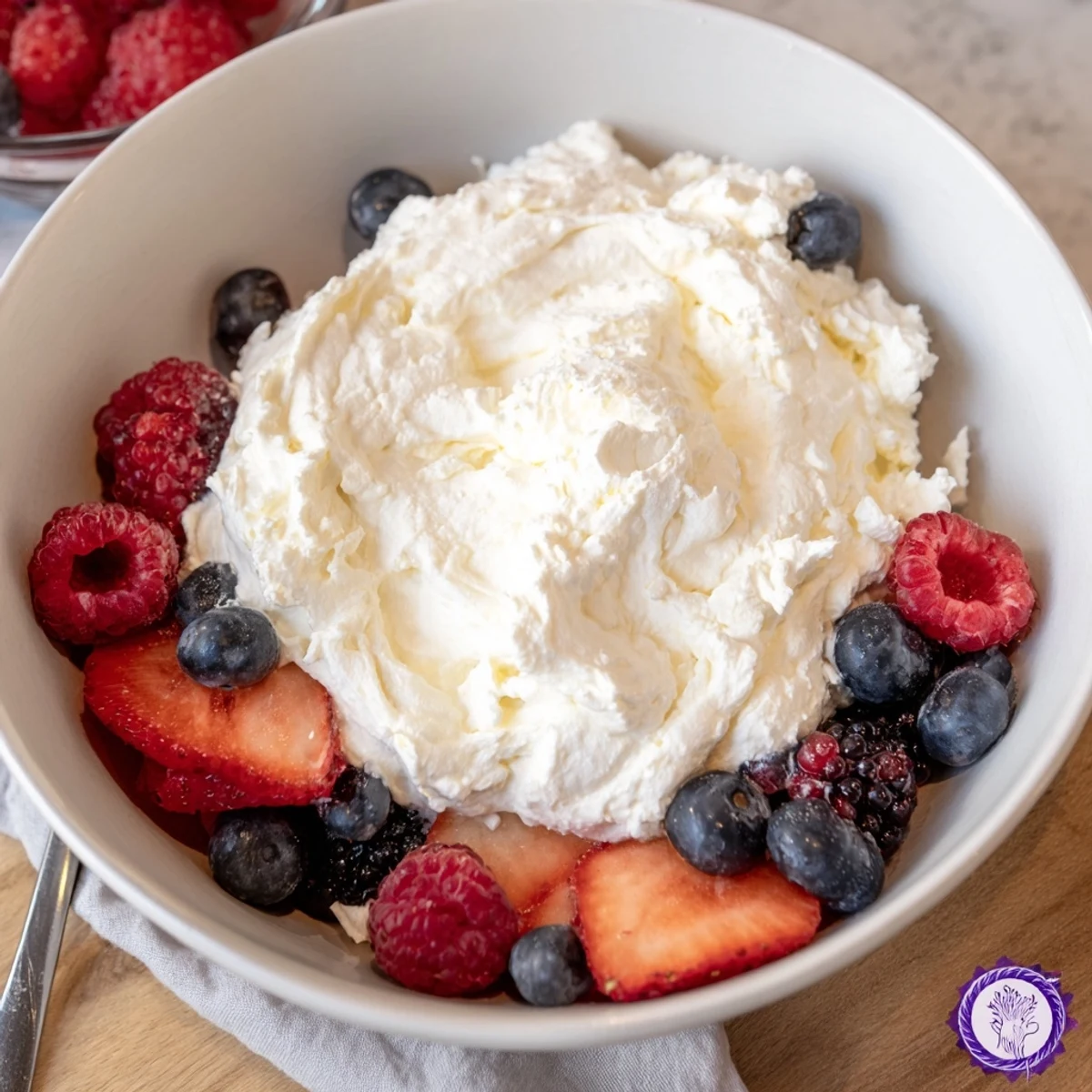 Fluffy cream cheese fruit dip with vibrant berries, a delightful, creamy, and easy dessert.