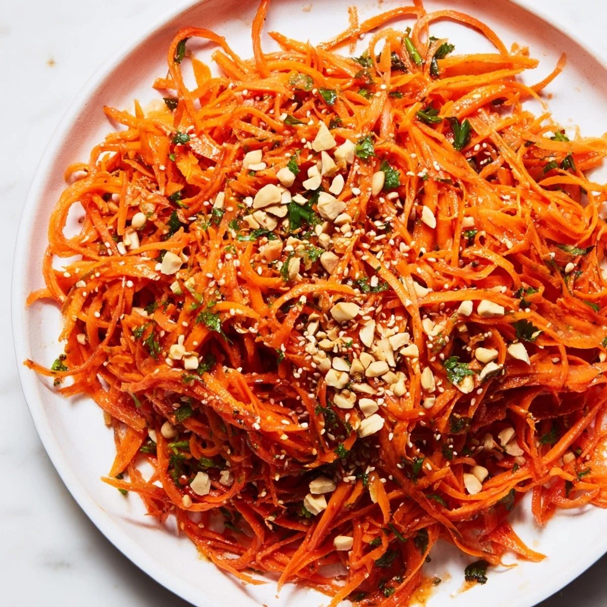 Freshly made Spicy Carrot Salad, perfect served as a side dish bursting with flavor and crunch.
