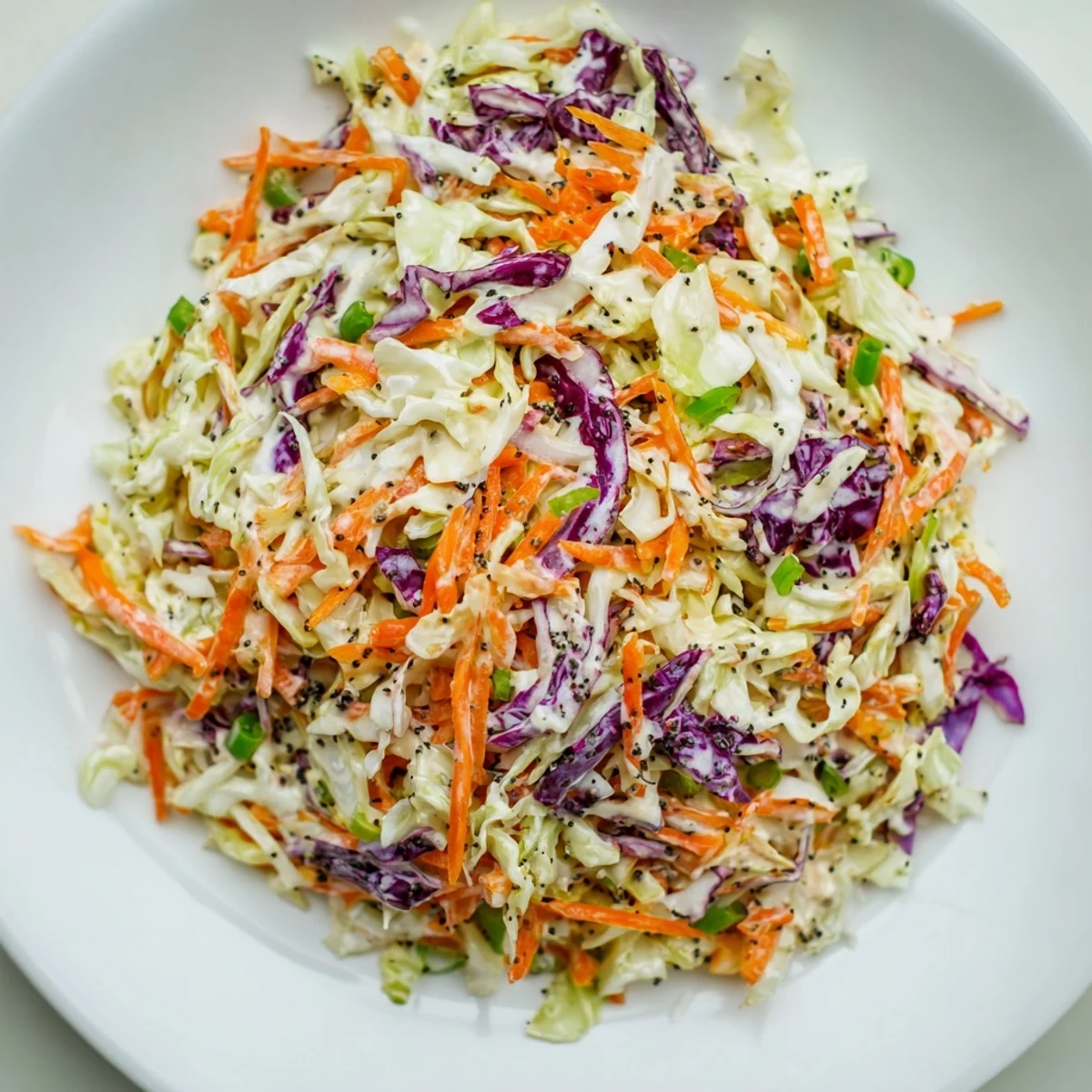 Freshly made Quick Coleslaw Salad visually shows crisp vegetables perfect to complement barbeque food.