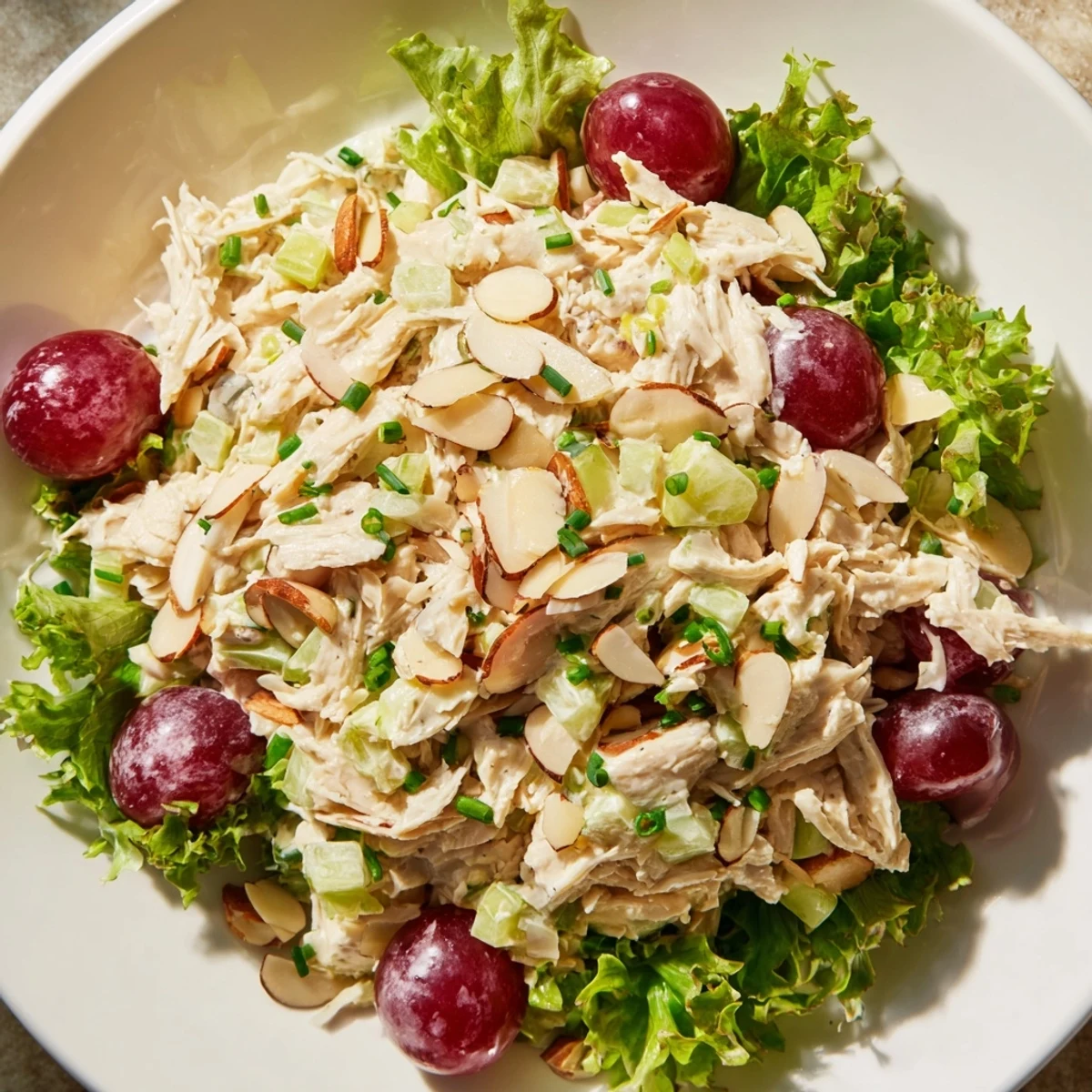 Golden-brown Crispy Chicken Salad piled on fresh greens, the perfect summer salad.