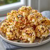 Homemade Parmesan Ranch Popcorn Clusters recipe—baked until crunchy & drizzled with melted butter.