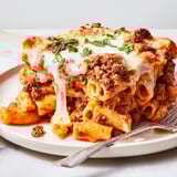 Deliciously baked ziti with savory meat sauce and bubbly cheese, perfect for dinner.  