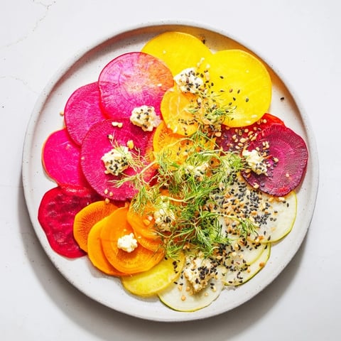 Platter of The Kinetic Motion Blur: colorful, thinly sliced veggies with creamy goat cheese.