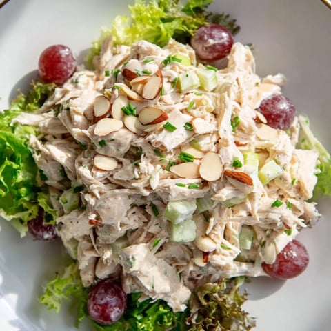 A close-up of creamy Crispy Chicken Salad with red grapes, perfect for a light lunch.
