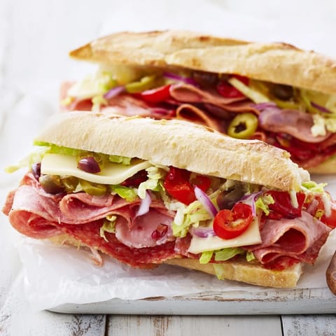 Delicious Flavor Mash-Up Sandwiches featuring hearty salami, cheeses, and zesty toppings for lunch.  