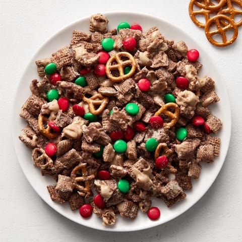 Close-up of sweet and crunchy Simplified Reindeer Chow, perfect for sharing at holiday parties.