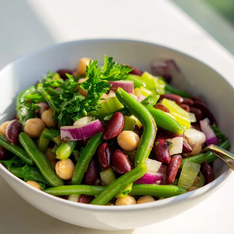 Hearty Three-Bean Salad, showcasing a rainbow of beans in a zesty vinaigrette.