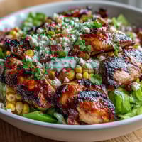 Healthy Chicken and Street Corn Bowls with grilled chicken, charred corn, fresh veggies, and creamy Greek yogurt dressing in a vibrant summer bowl.  