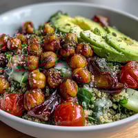 Lemon Vinaigrette Grain Bowls with Roasted Chickpeas: A colorful, nourishing bowl layered with fluffy quinoa, crisp veggies, and golden chickpeas, all drizzled with a bright lemon dressing.