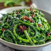 Shaved asparagus and pea salad with lemon dressing, vibrant spring greens with crisp asparagus ribbons and sweet peas.